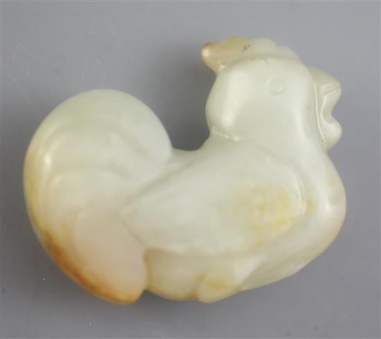 A Chinese pale Celadon and russet jade cockerel figure, 4.3cm